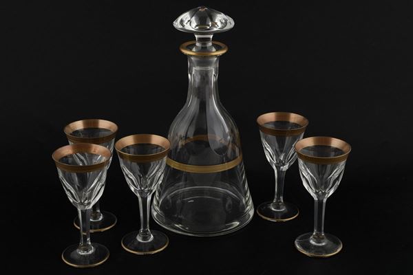 Liquor set with five small glasses and a bottle with a stopper