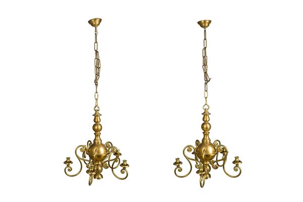 Pair of golden metal chandeliers