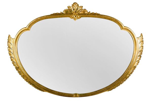Specchiera ovale con cornice in legno dorato