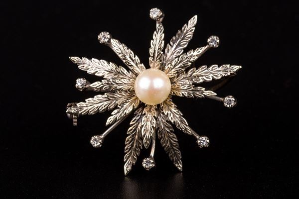 Spilla floreale in oro bianco 18kt