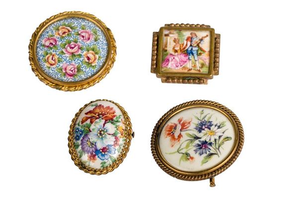 Lot of four painted porcelain brooches