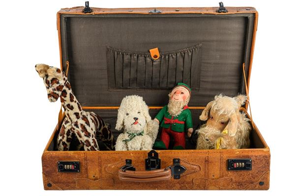 Four vintage stuffed animals, including two dogs, a giraffe and a Lenci-style gnome