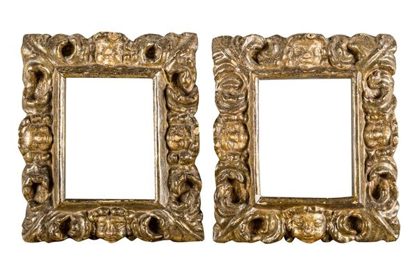 Pair of frames in carved and silvered wood