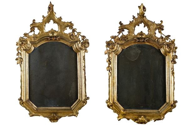 Pair of mirrors in carved and silvered wood