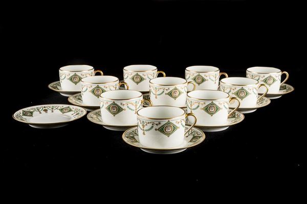 Ten Limoges teacups with eleven saucers