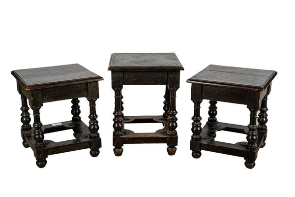 Three stools in ebonized wood