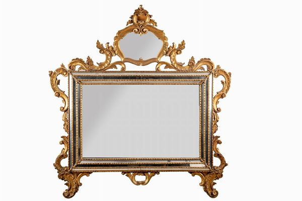 Mirror in wood and gilded