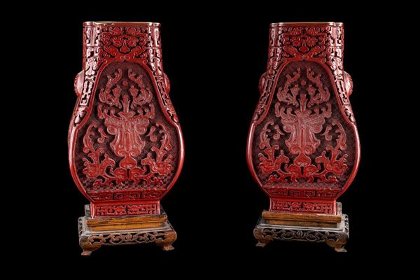 Pair of red lacquer vases