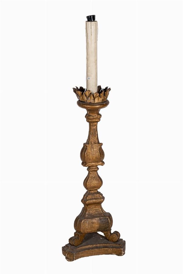 Candlestick in gilded wood