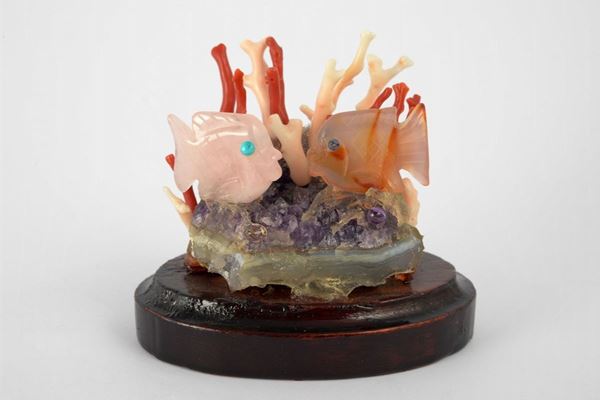 Group depicting an aquarium in various semi-precious stones and coral on an amethyst base