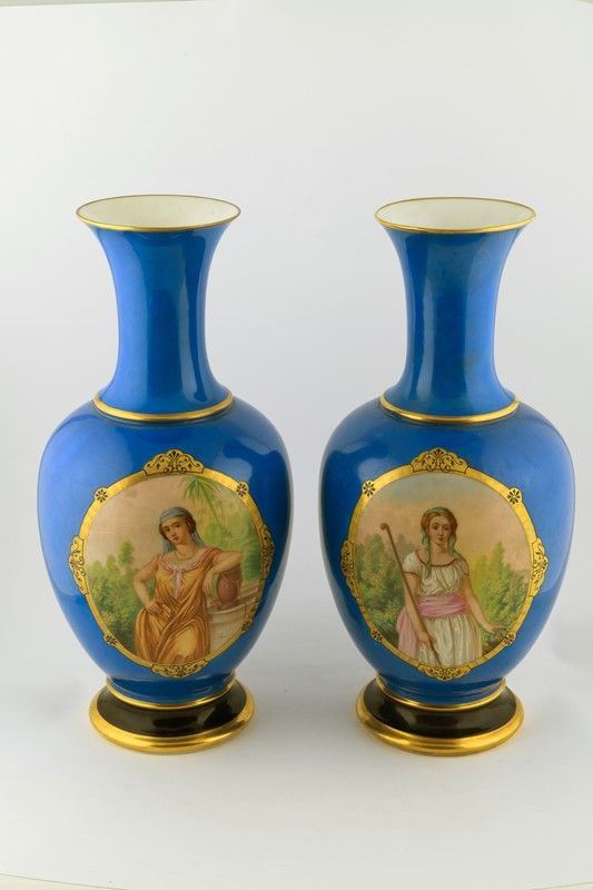 Pair of porcelain vases with a blue background
